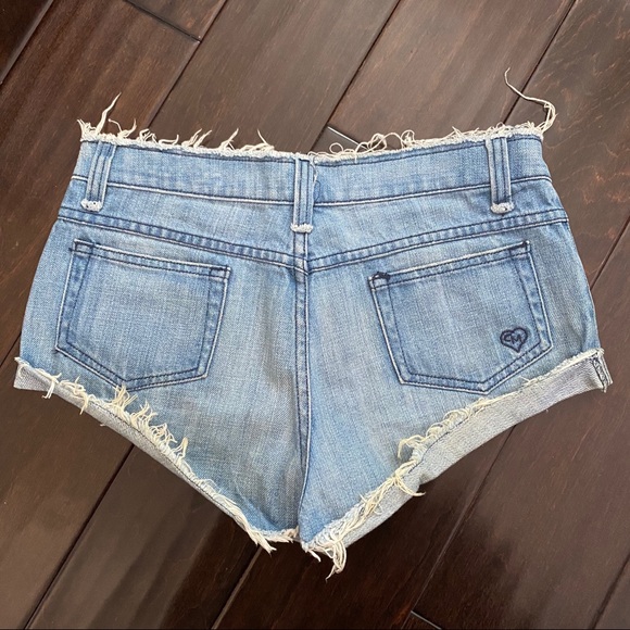 Mid Rise Medium Wash Blue Cheeky Denim Shorts - Picture 3 of 4